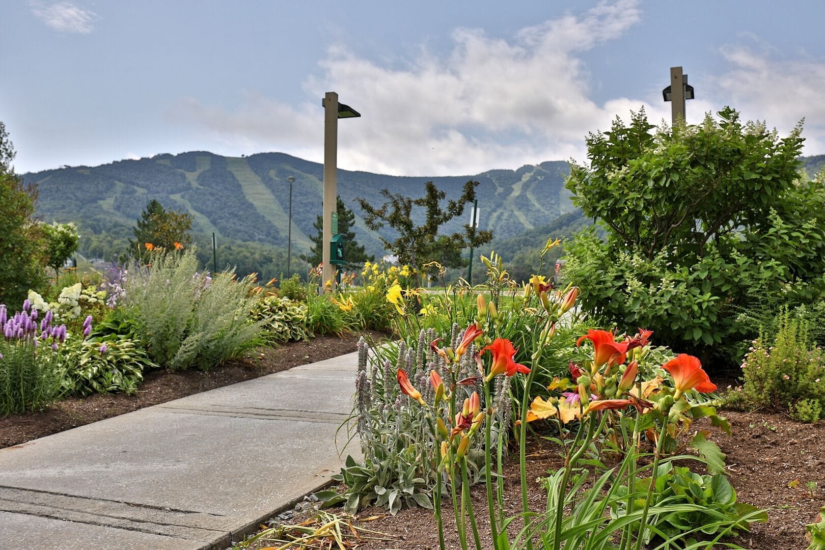 Seasonal flower gardens with Green Mountain backdrop at Mountain Green Resort