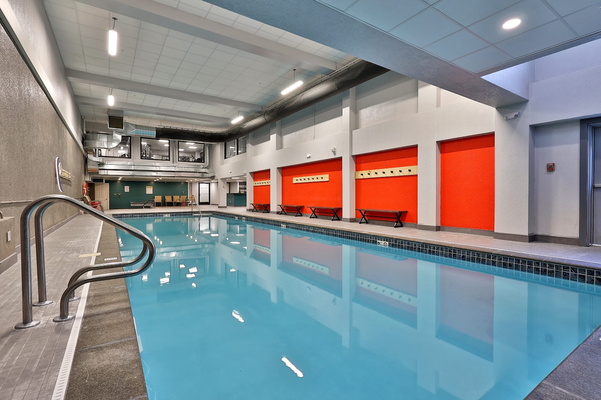 Spacious indoor pool and recreation area with lounge seating in Building 3 amenities hub at Mountain Green vacation rentals