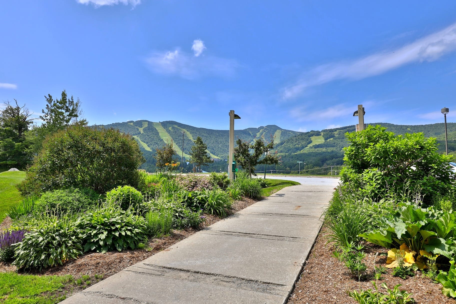 Walking paths through Mountain Green Resort with views toward Killington ski trails and Vermont peaks