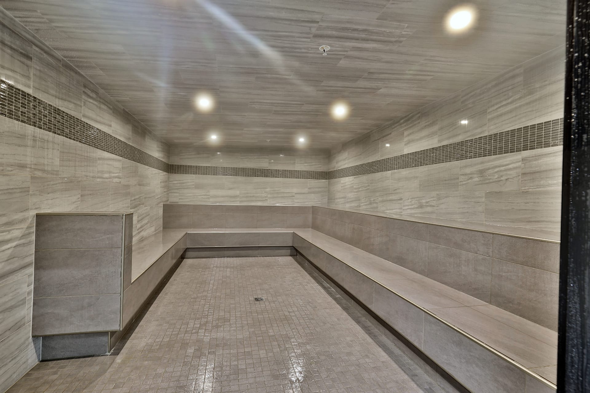 Cedar-lined sauna room with bench seating for guests at Mountain Green Resort